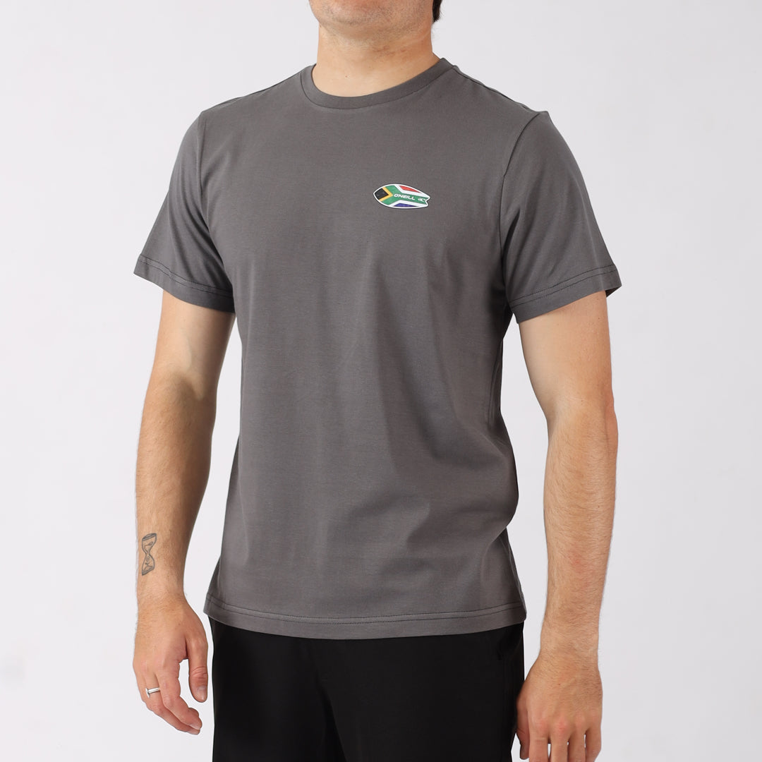 Person wearing a gray t-shirt with a small logo on a white background