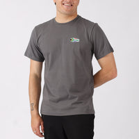 Man wearing a gray t-shirt with a logo on a white background