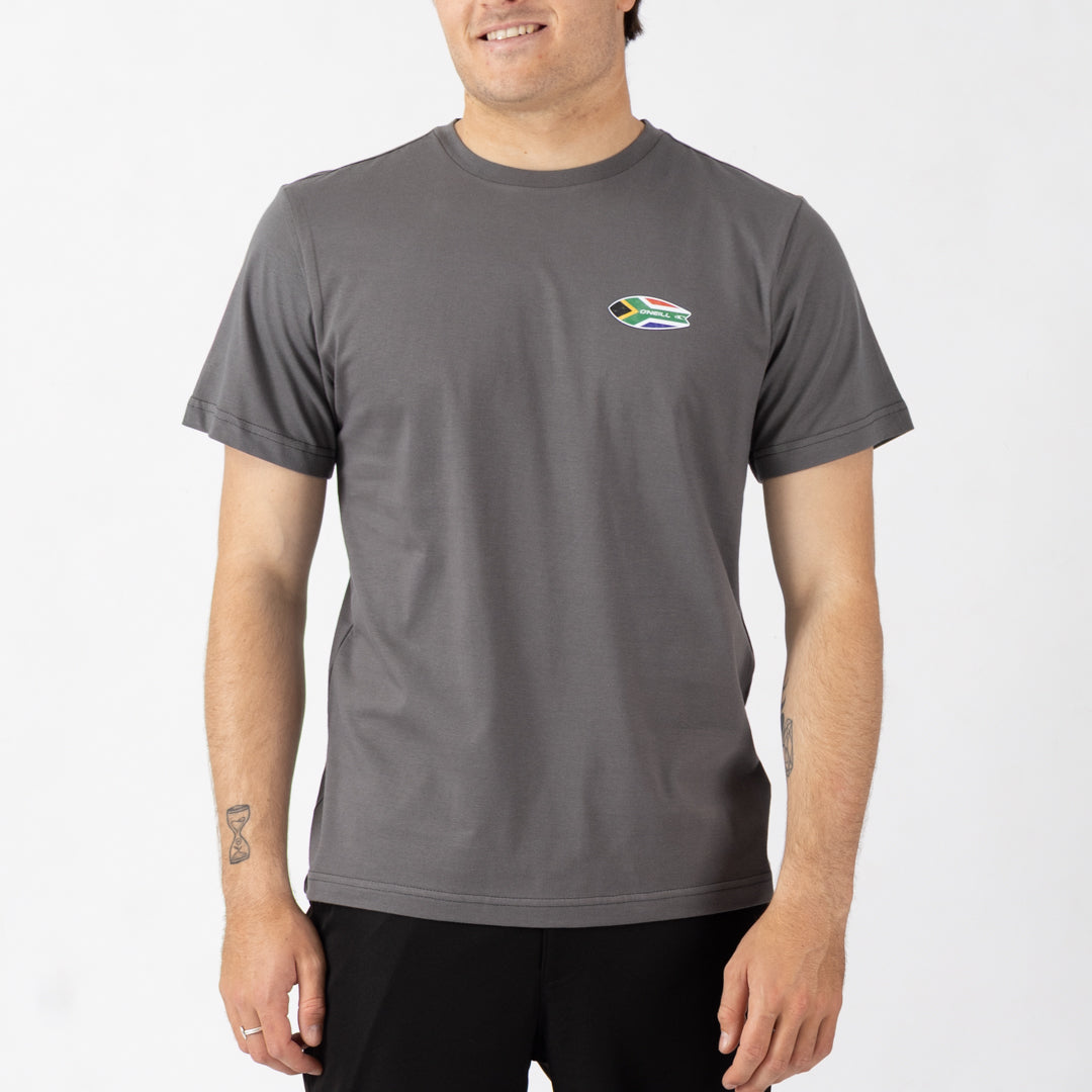 Man wearing a gray t-shirt with a logo on a white background
