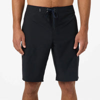 Black shorts worn by a person on a white background