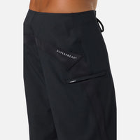 Black pants with 'SuperFreak' branding on a white background