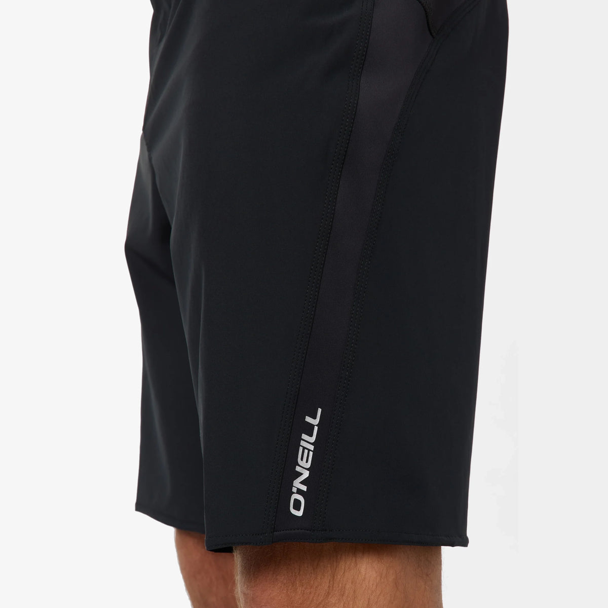 Black shorts with a visible brand logo on a white background