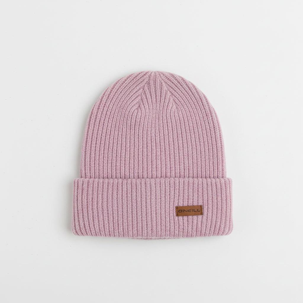 Pink knit beanie with a brand label on a light gray background
