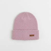 Pink knit beanie with a brand label on a light gray background