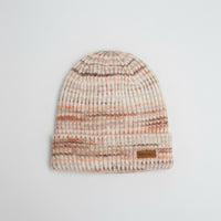 Knitted beanie with a brand label on a light gray background